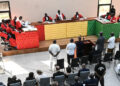 The eleven accused stand as the session starts inside the new courthouse in Conakry on September 28, 2022 during the opening of the trial for the massacre of 156 people in September 2009. - The trial of former Guinean dictator Moussa Dadis Camara and other former officials over the September 28, 2009 stadium massacre opened on September 28, 2022, in the capital Conakry, an AFP correspondent reported. (Photo by CELLOU BINANI / AFP)